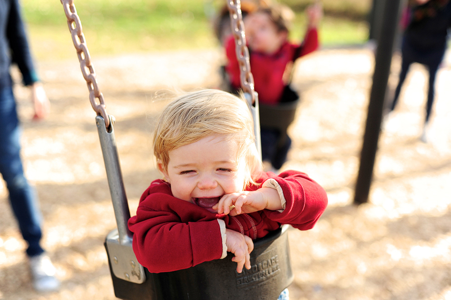 baby laughing in swing