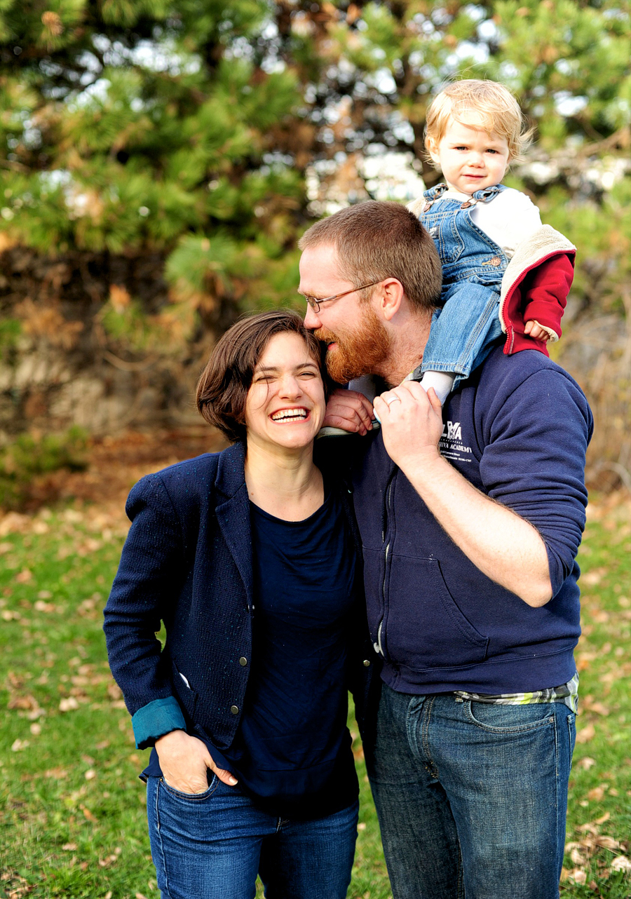 family with baby on shoulders