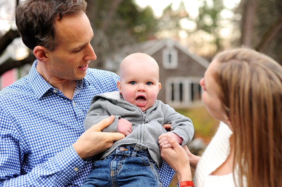 parents holding toddler son