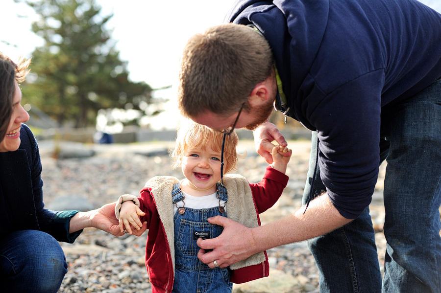 family tickling baby