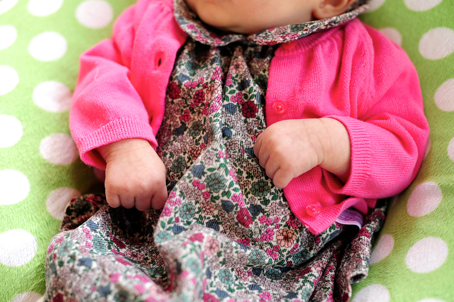 baby in flowered dress