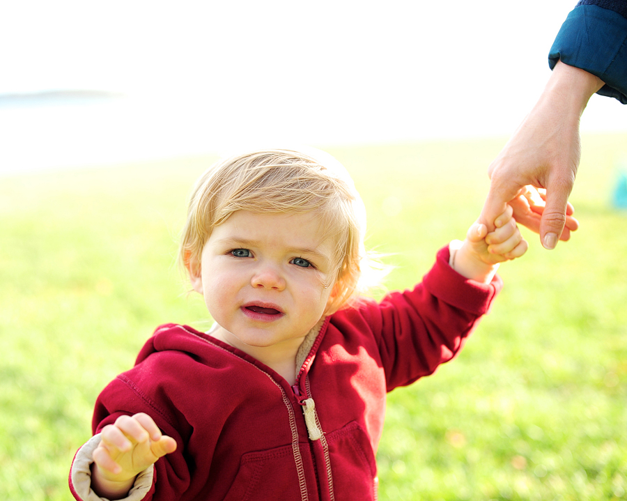 blonde boy looking into camera