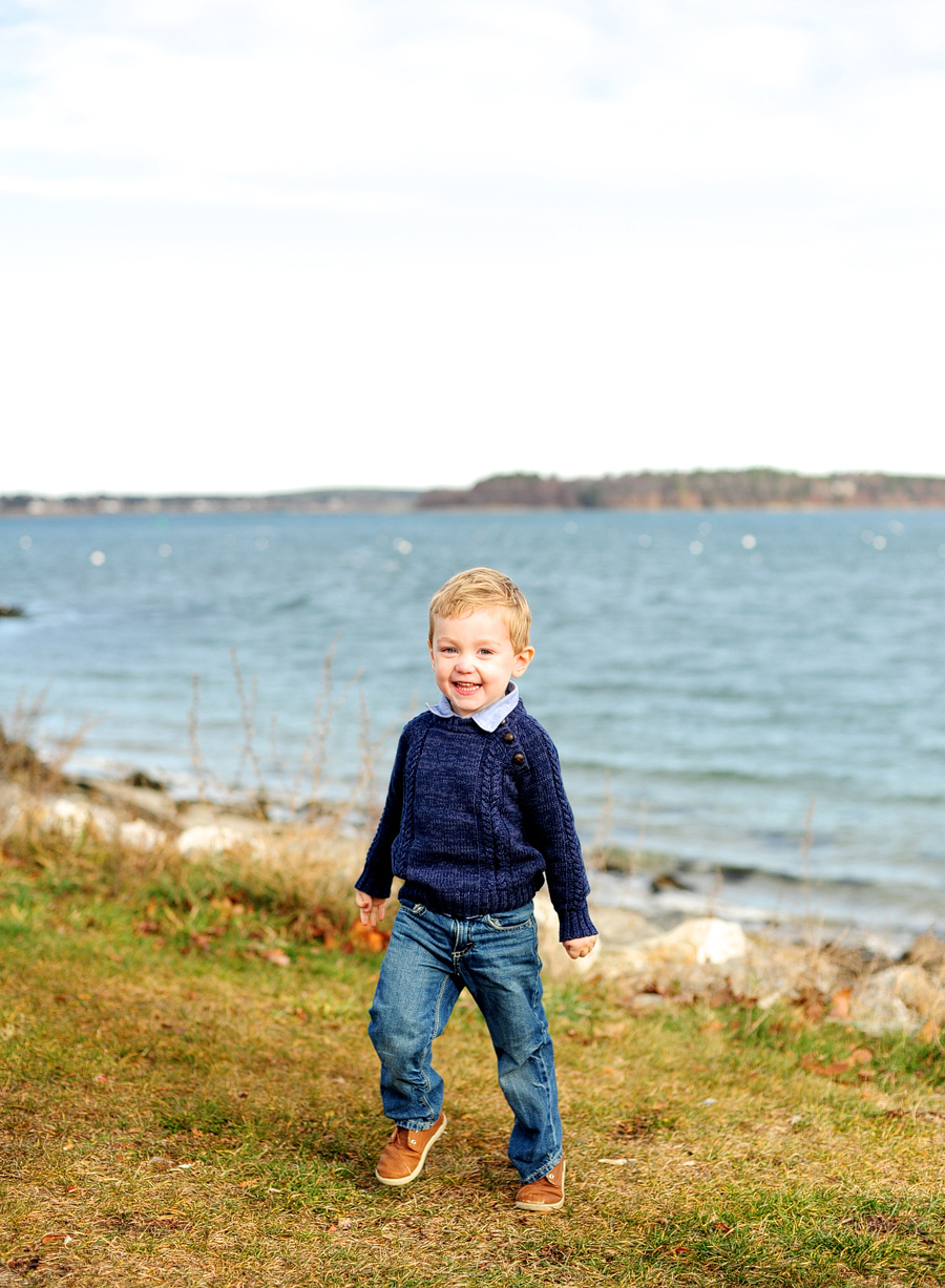 boy in blue sweater at east end beach