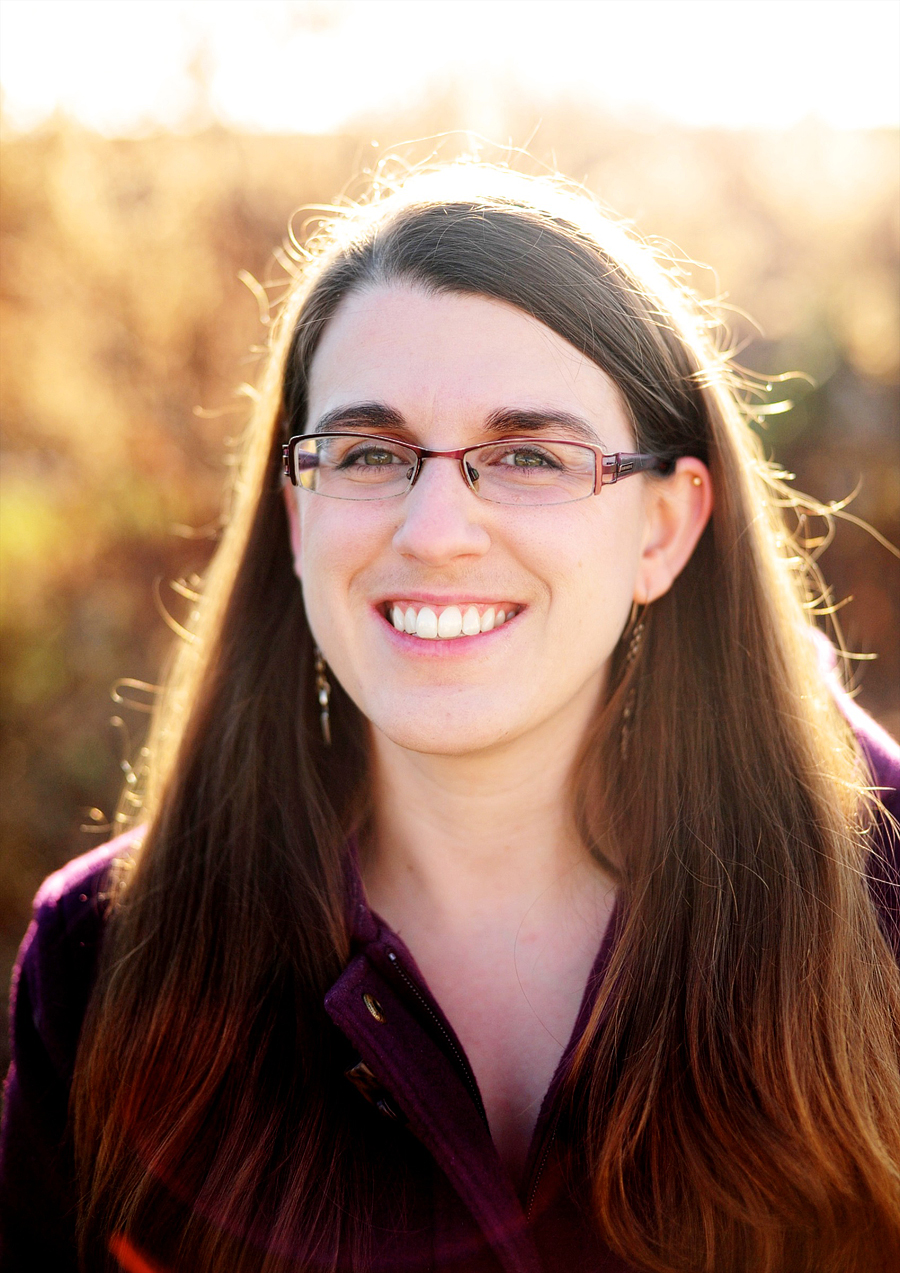 woman smiling at sunset