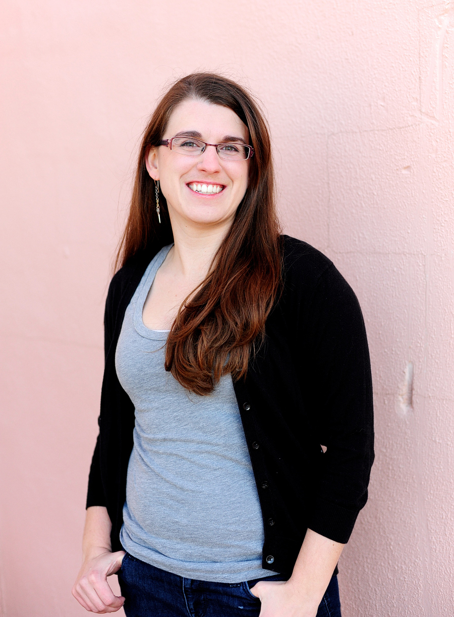 woman in front of pink wall