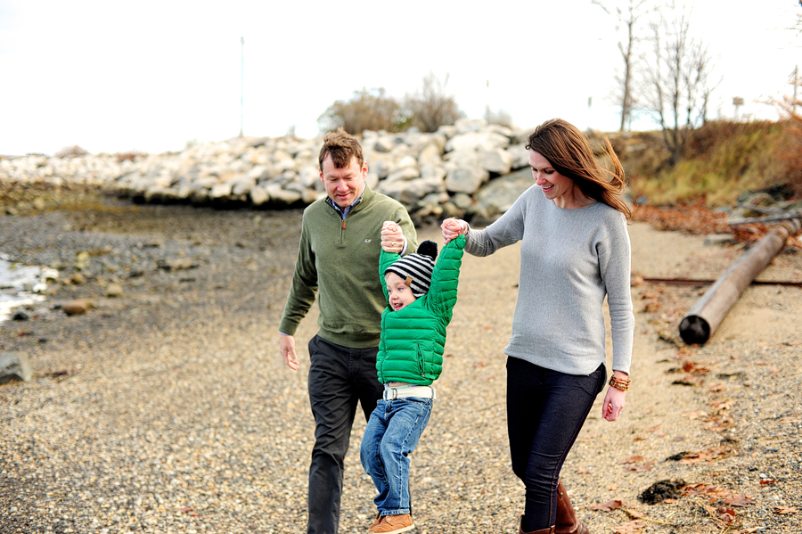 family playing on beach