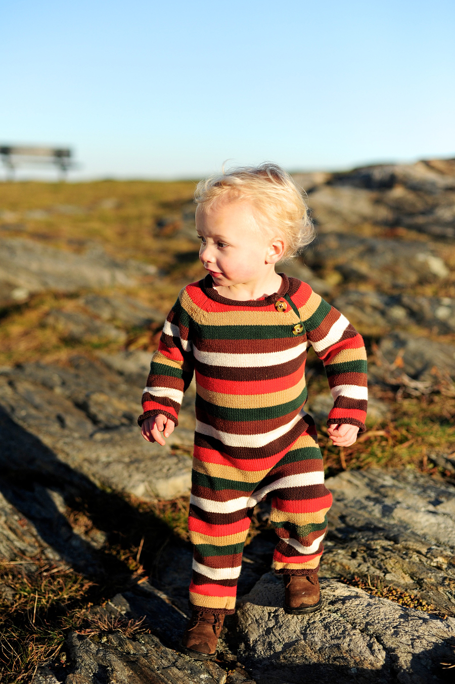 little boy in striped jumpsuit