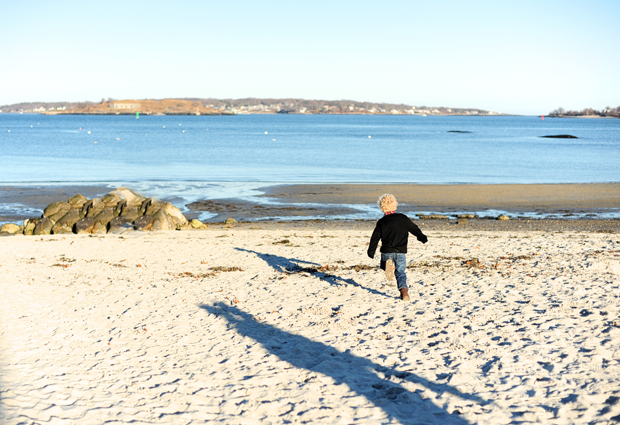 kid running along willard beach