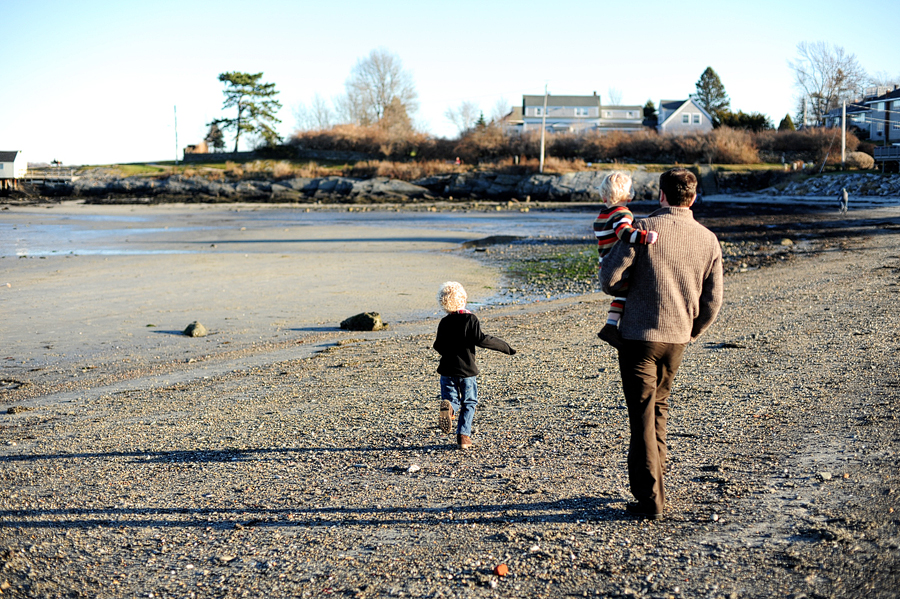 family walking along beach