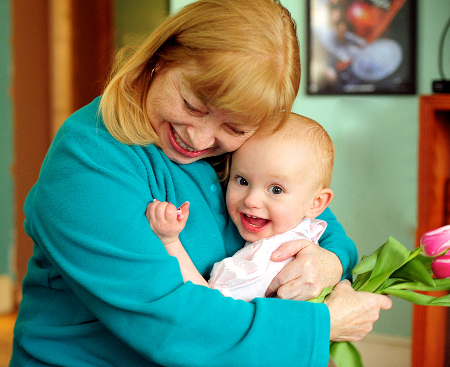 grandmother hugging girl