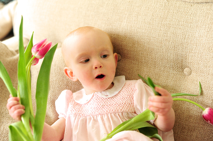 girl playing with tulip