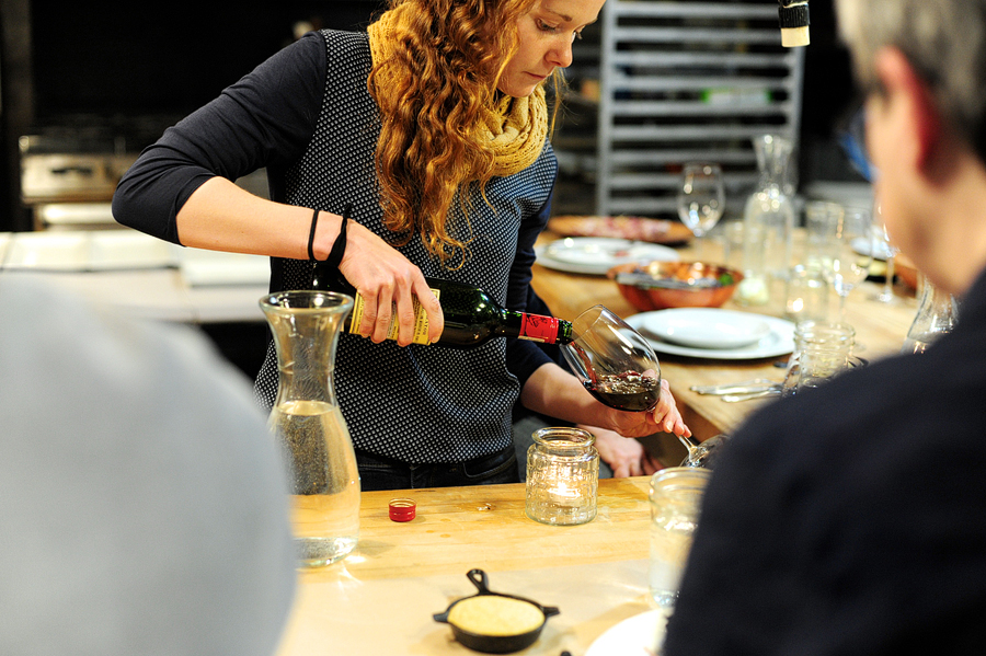 woman pouring wine