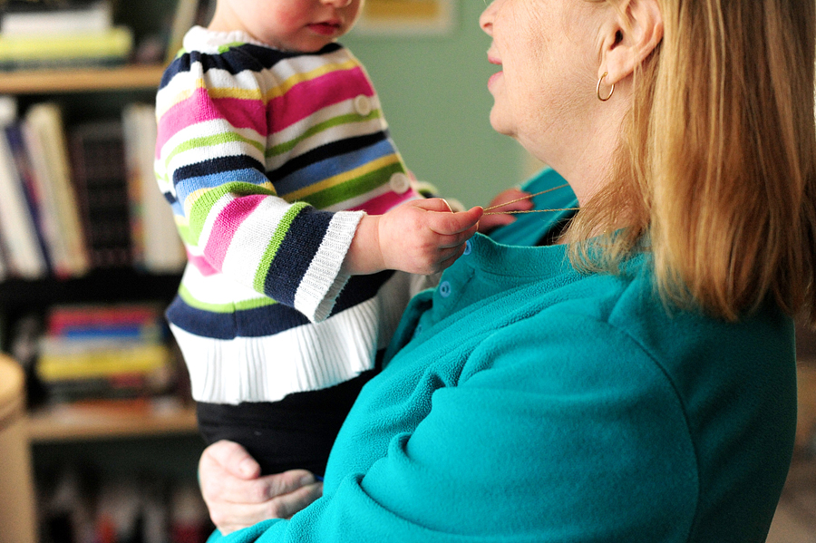 girl held by grandmother