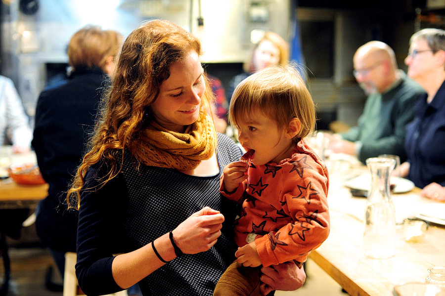 woman feeding child