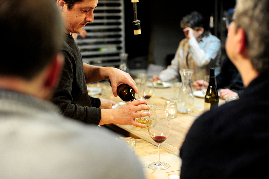 man pouring wine