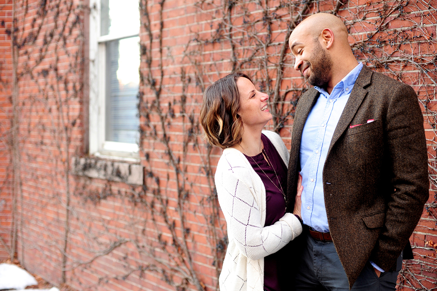 couple in front of brick wall