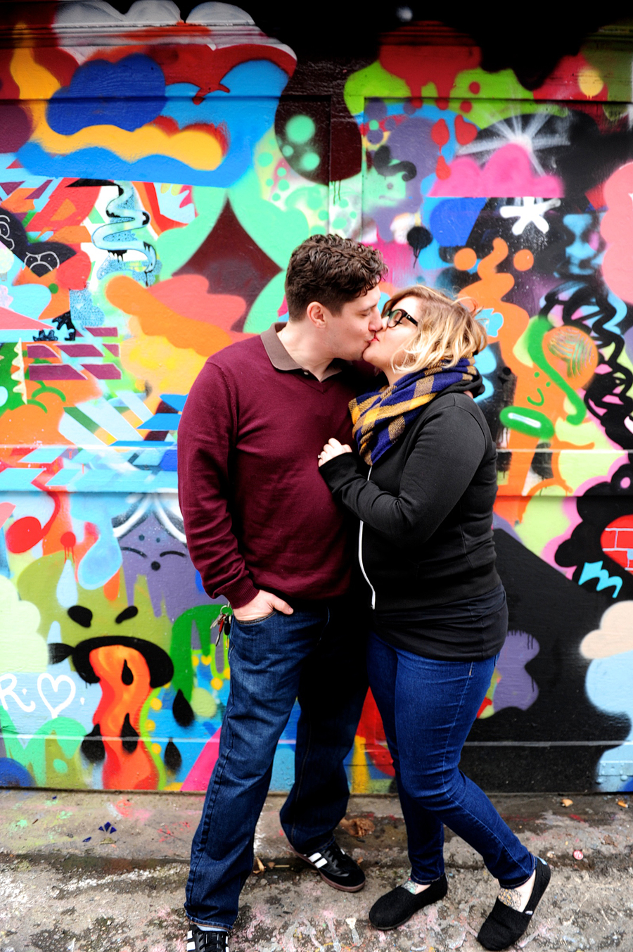 couple in front of graffiti