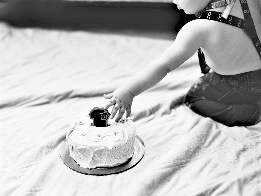 baby touching cake