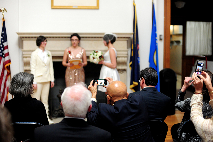 guest taking photo of ceremony