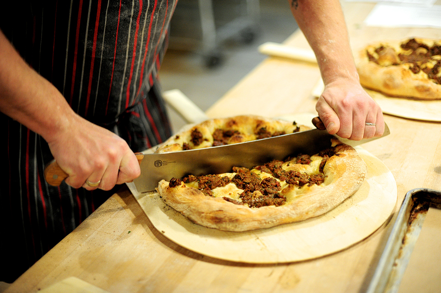 cutting a pizza