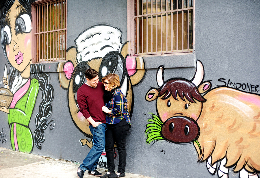 couple in front of graffiti