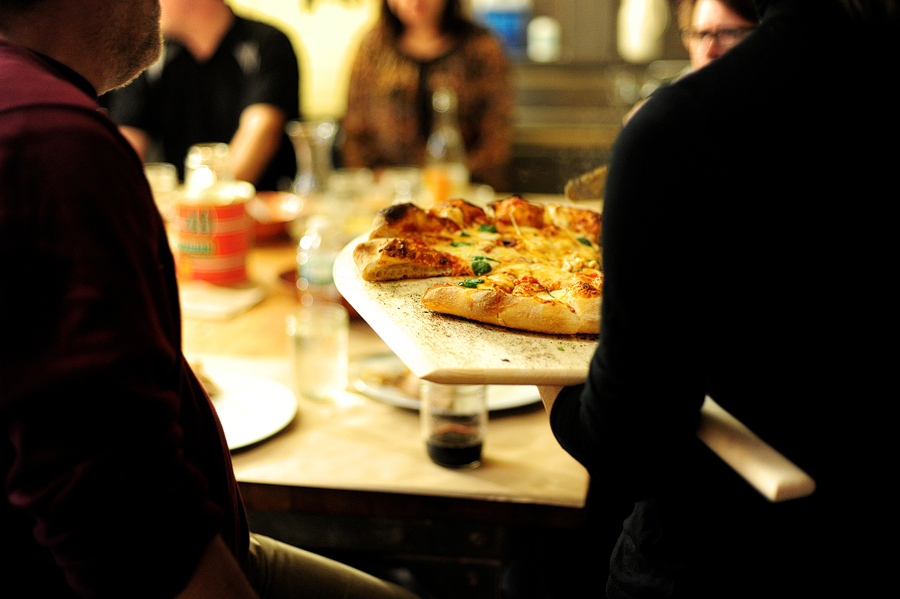 guests being served pizza