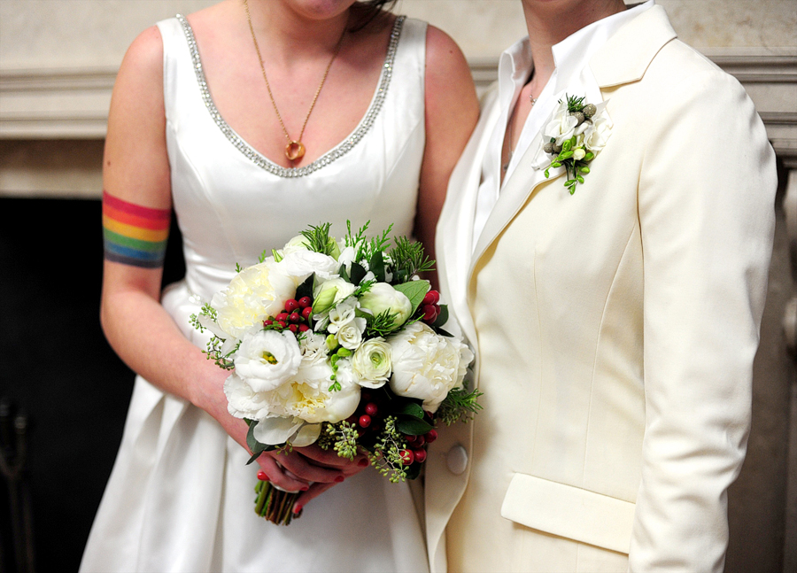 tattooed couple with bouquet