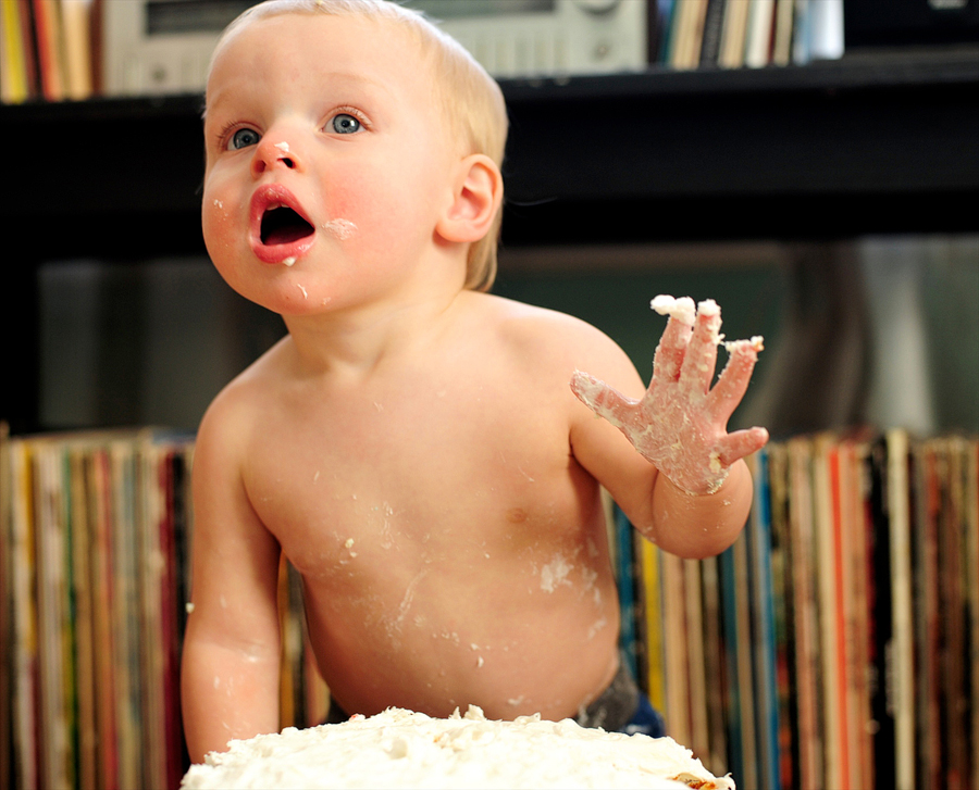 one year old eating cake