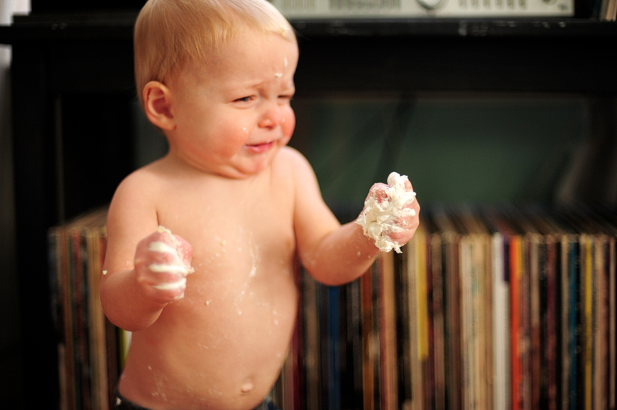 baby squishing frosting