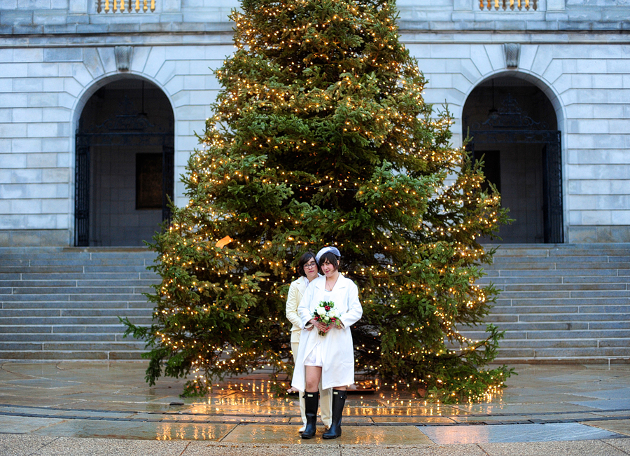 couple in front of christmas tree