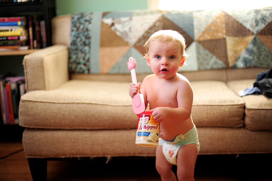 baby holding frosting