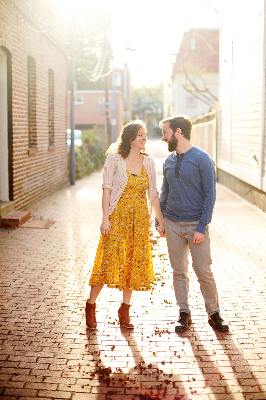 couple standing in alleyway