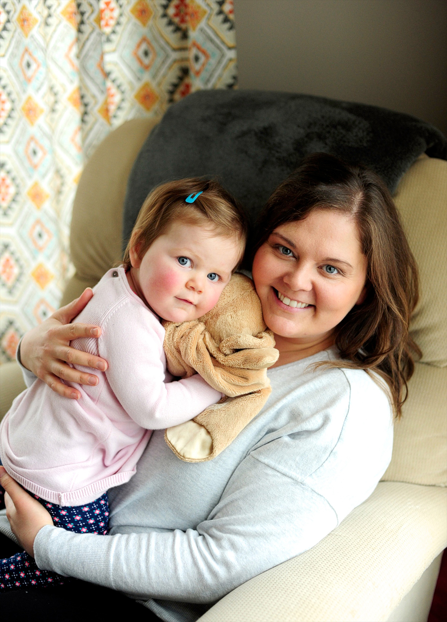 mom holding her baby girl