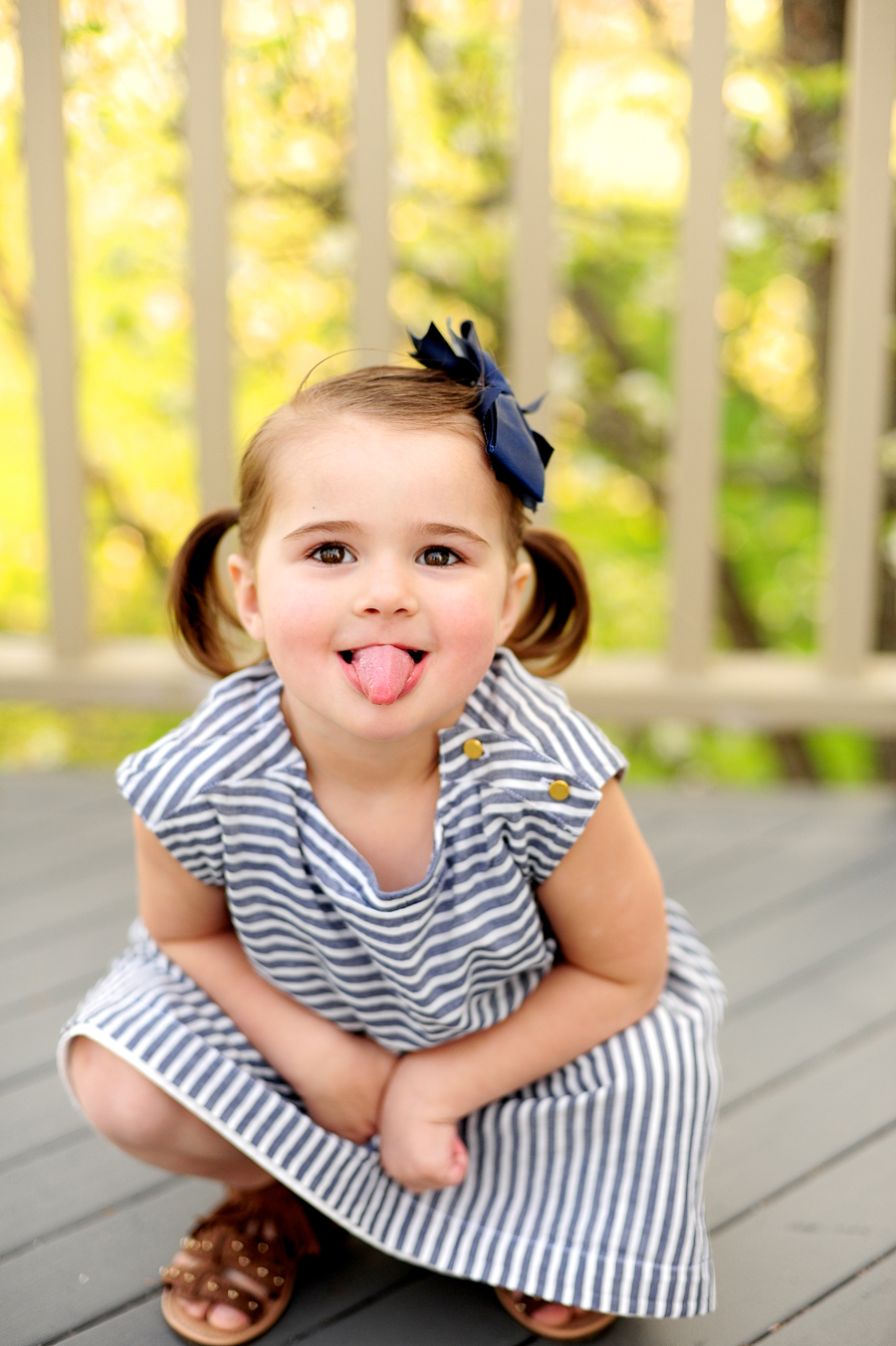 little girl making a goofy face