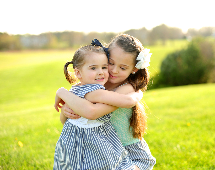 sisters hugging