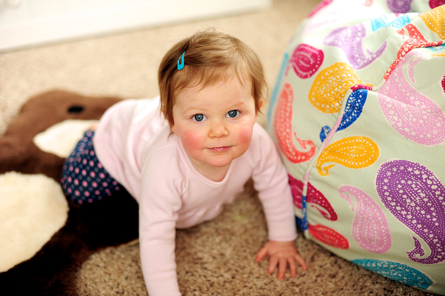 baby crawling around nursery