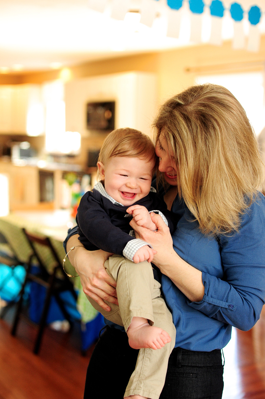 mother tickling son