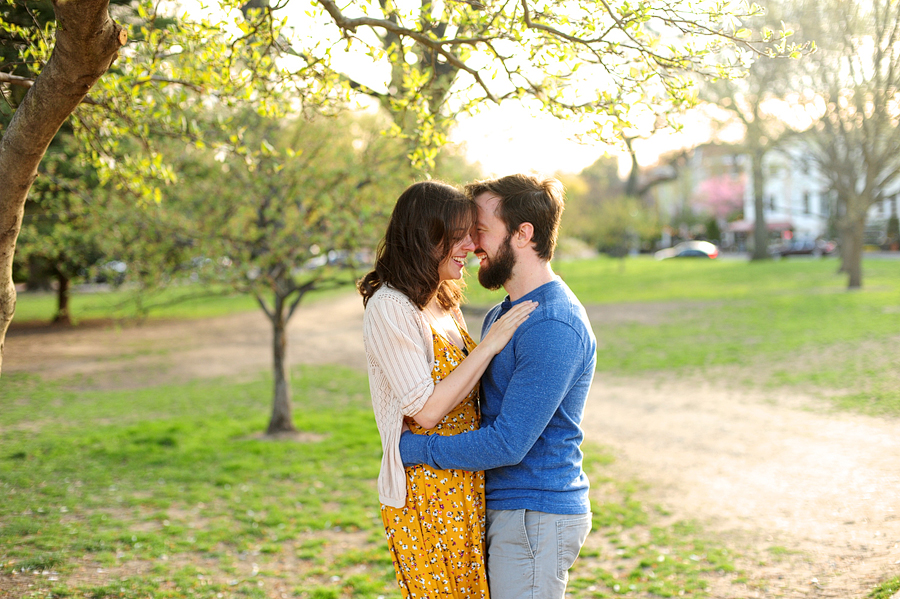 couple nuzzling in park