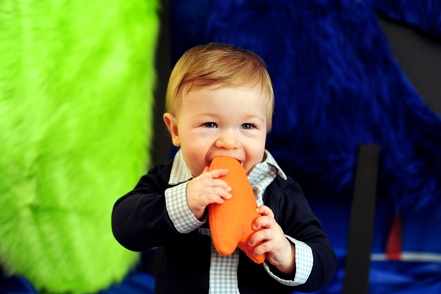 baby chewing on toy