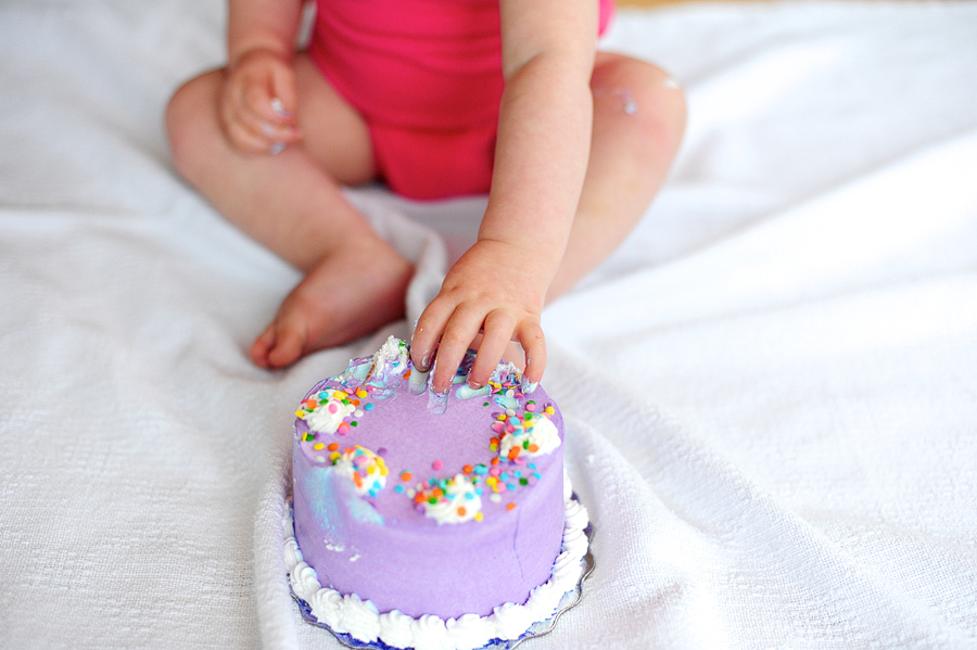 baby eating cake