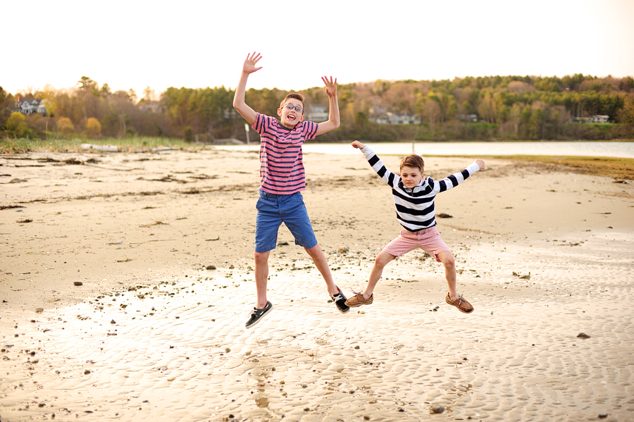 boys jumping on the beach