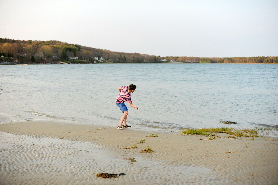 kid skipping stones