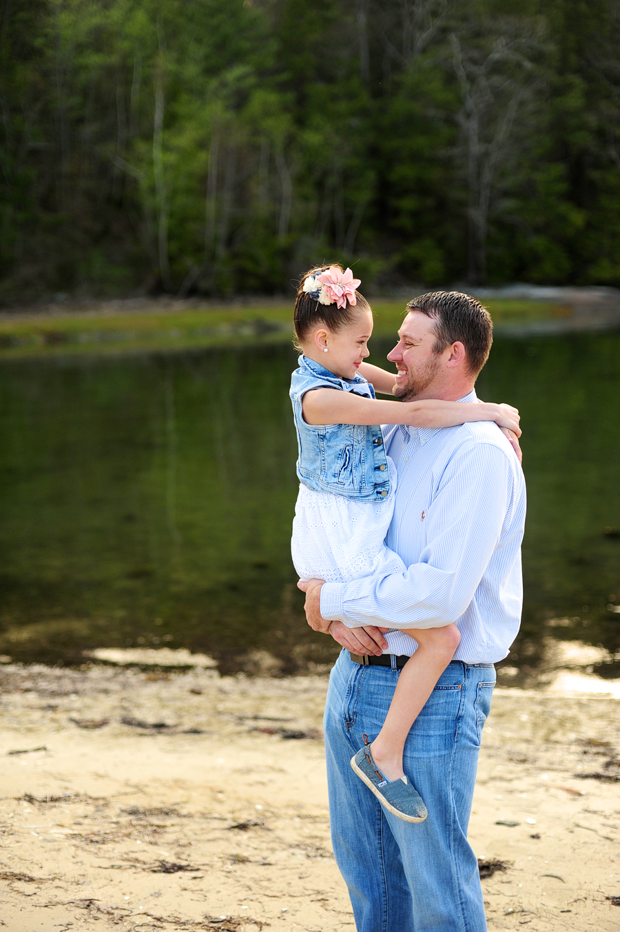 father holding his daughter