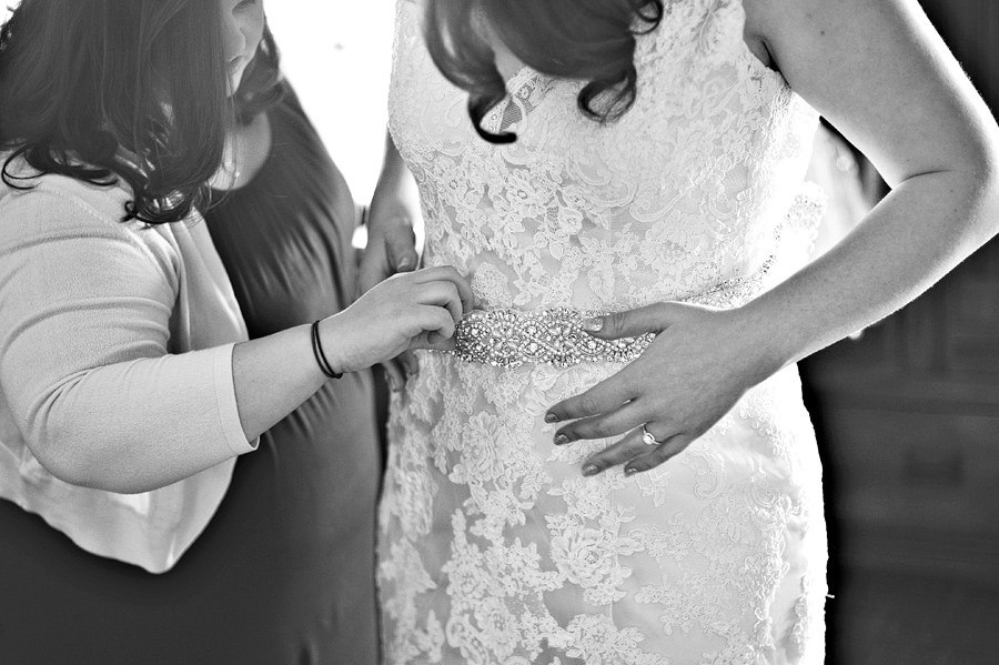 a bride getting ready with her bridesmaid