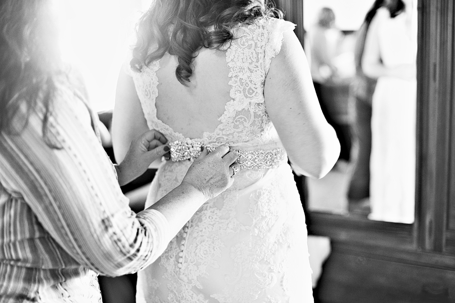 black and white photo of a bride getting ready