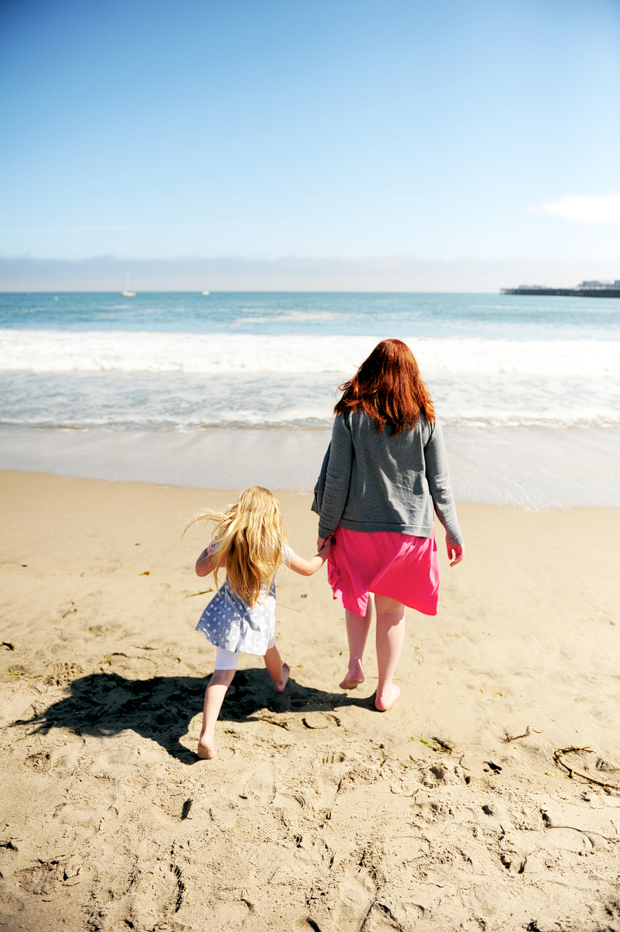 redhead mother and daughter on santa cruz beach