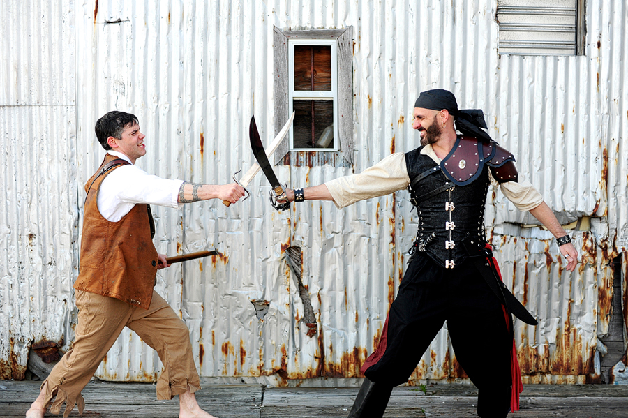 two pirates having a sword fight