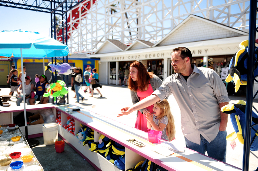 family playing games at santa cruz beach boardwalk