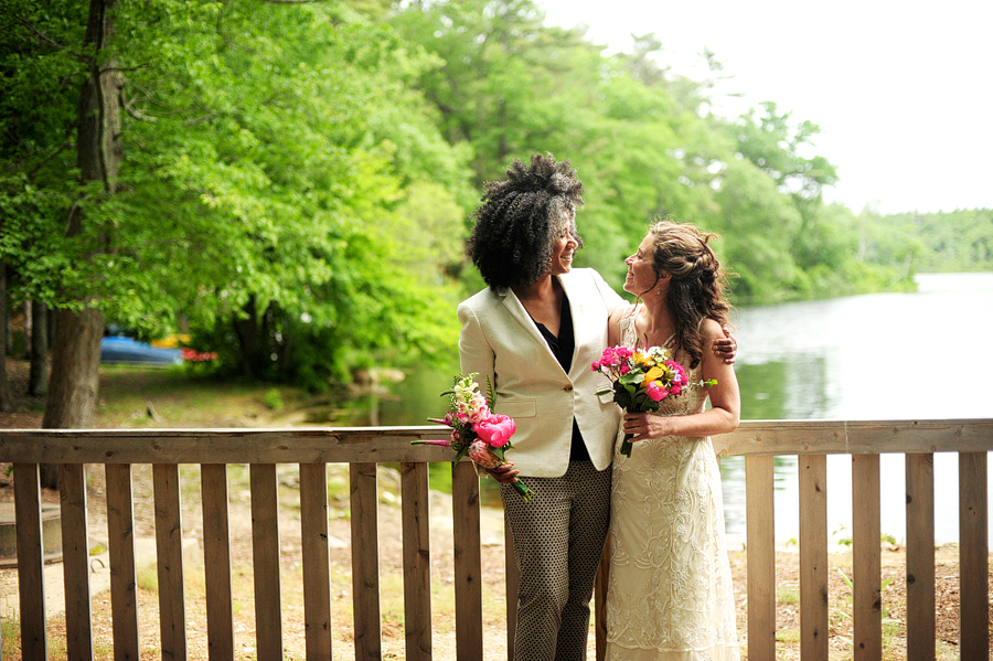two brides posing by a lake in duxbury, ma