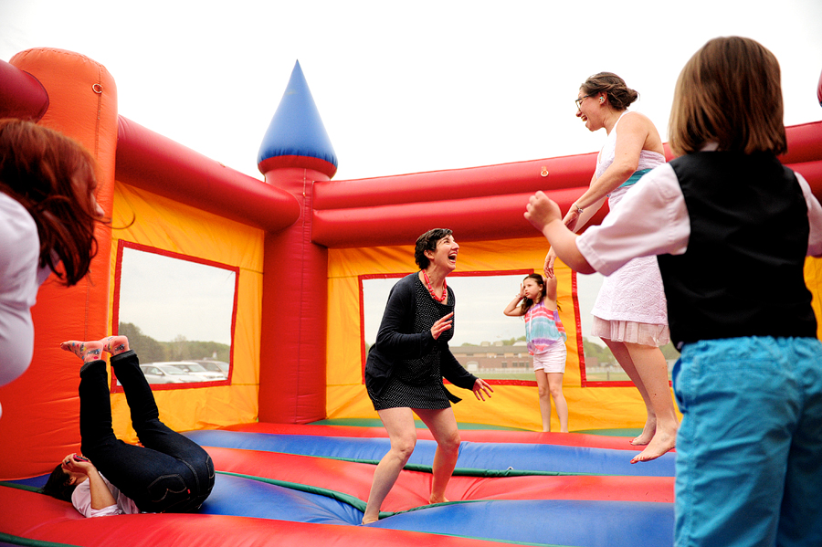 wedding couple in bouncy castle